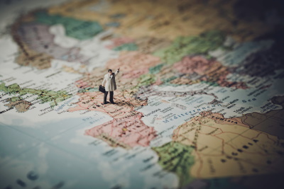 miniature businessman map europe